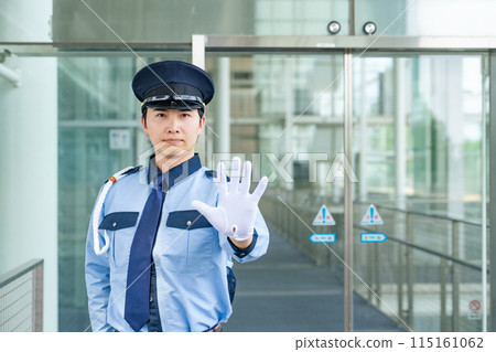 A security guard stops A security guard stops 115161062