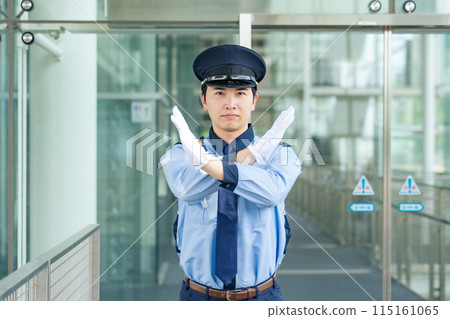 Security guard showing cross mark 115161065