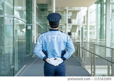 Security guard's back view 115161069