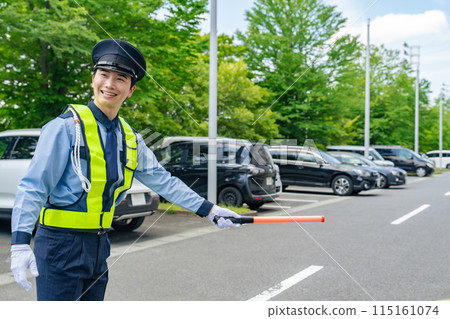 Security guard to guide traffic Security guard to guide traffic 115161074