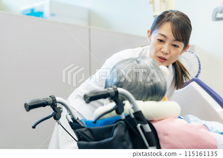 Female doctor/caregiver caring for the elderly 115161135