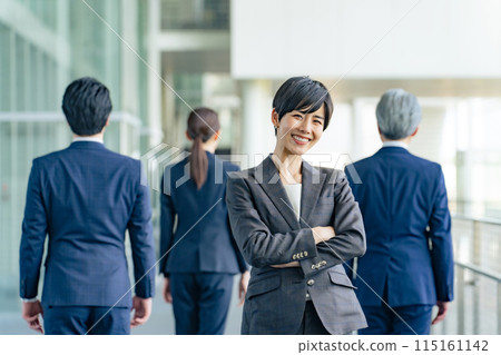 Smiling female business person Smiling female business person 115161142
