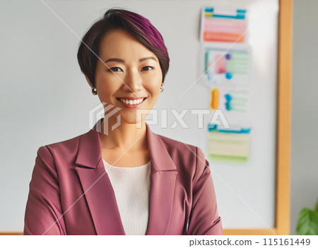 A businesswoman showing documents in front of a whiteboard 115161449