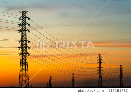 A row of power transmission towers and a sunset sky b-6 Warm colors High contrast A row of power transmission towers and a sunset sky b-6 Warm colors High contrast 115161782