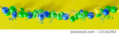 Festive garland of balloons, featuring Brazil's national colors of green, yellow, and blue, adorned with the motto Ordem e Progresso. Brazilian Independence Day. National holiday in Brazil. 3D render. Festive garland of balloons, featuring Brazil's national colors of green, yellow, and blue, adorned with the motto Ordem e Progresso. Brazilian Independence Day. National holiday in Brazil. 3D render. 115162362