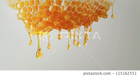 Golden honey dripping from the honeycomb, pure and natural Golden honey dripping from the honeycomb, pure and natural 115162551
