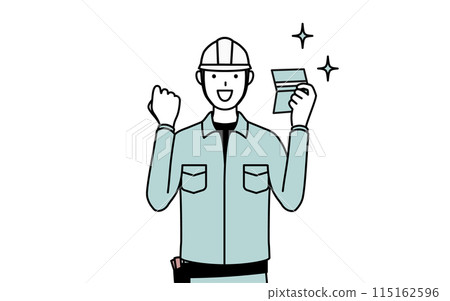 A man wearing a helmet and work clothes is happy to see his bankbook 115162596