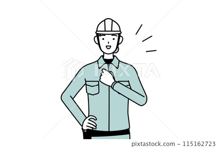 A female engineer in a helmet and work clothes beating her chest 115162723