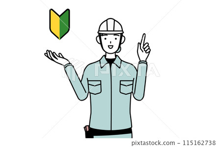 A female engineer wearing a helmet and work clothes showing the green leaf mark A female engineer wearing a helmet and work clothes showing the green leaf mark 115162738