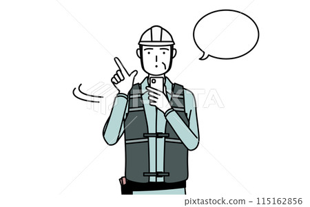 A senior male engineer in a helmet and work clothes operating a smartphone 115162856