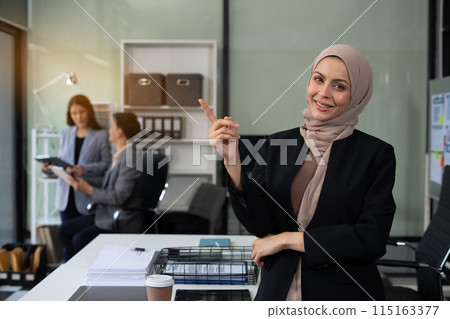 Happy young businesswoman presenting or pointing, happy working. 115163377