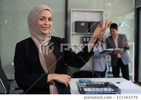 Happy young businesswoman presenting or pointing, happy working. 115163379