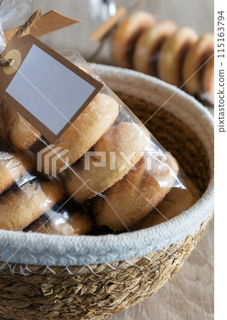 Homemade cookies in a bag inside a basket 115163794