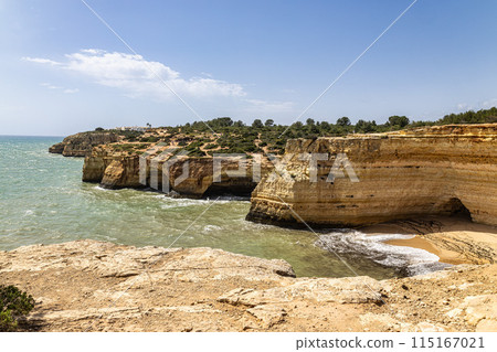Portuguese coast in Benagil, Algarve, Portugal. Praia da Corredoura. Seven Hangging Valleys Trail. Portuguese coast in Benagil, Algarve, Portugal. Praia da Corredoura. Seven Hangging Valleys Trail. 115167021