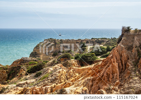 Praia da Marinha Beach among rock islets and cliffs seen from Seven Hanging Valleys Trail, Algarve, Portugal Praia da Marinha Beach among rock islets and cliffs seen from Seven Hanging Valleys Trail, Algarve, Portugal 115167024