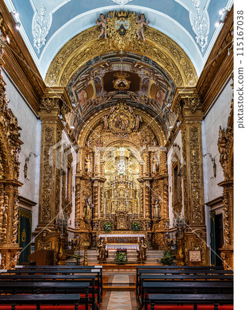 The intricate golden interior of the Carmelite church Igreja do Carmo in the old town of Faro in Portugal 115167038