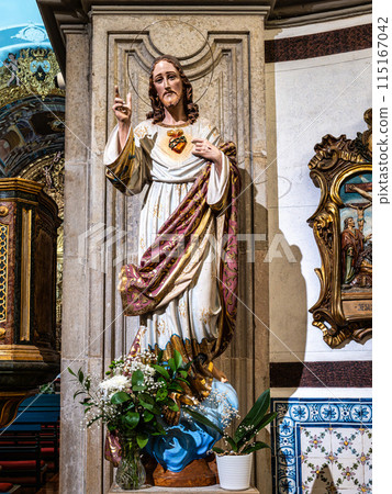The intricate golden interior of the Carmelite church Igreja do Carmo in the old town of Faro in Portugal 115167042