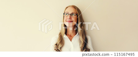 Happy smiling caucasian middle aged woman employee looking away thinking on white background Happy smiling caucasian middle aged woman employee looking away thinking on white background 115167495