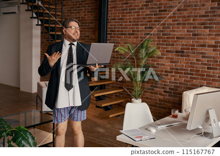 Funny businessman in formal suit and underwear giving self presentation online 115167767