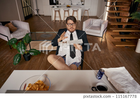 Lazy relaxed funny businessman working online comfortably high angle view Lazy relaxed funny businessman working online comfortably high angle view 115167778