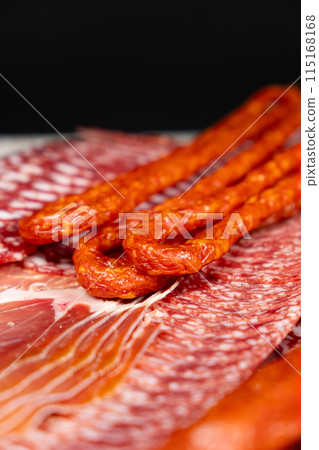 Various cold meat appetizers - Spanish ham cerrato, salami, sausages Various cold meat appetizers - Spanish ham cerrato, salami, sausages 115168168