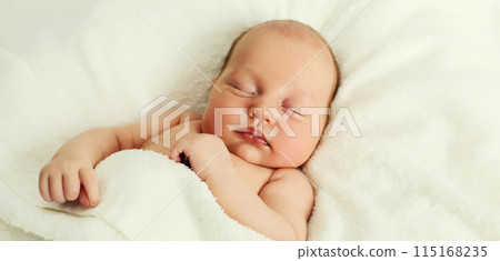 Portrait of infant sweet sleeping lying on white bed at home Portrait of infant sweet sleeping lying on white bed at home 115168235
