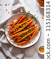 Baby carrots roasted 115168314