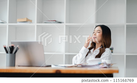 young beautiful asian woman working in office 115168769