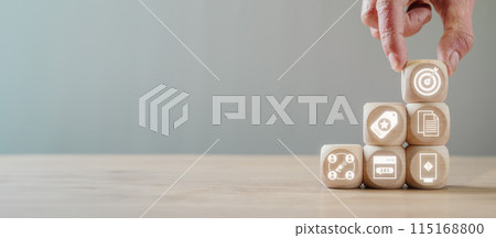 Advertising concept, Hand holding wooden block on desk with Advertising icon on virtual screen. 115168800
