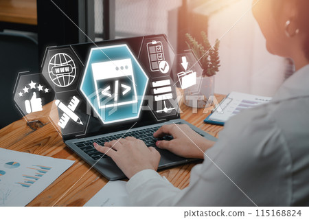 Web design concept, Businesswoman using laptop computer on desk with Web design icon on virtual screen. Web design concept, Businesswoman using laptop computer on desk with Web design icon on virtual screen. 115168824
