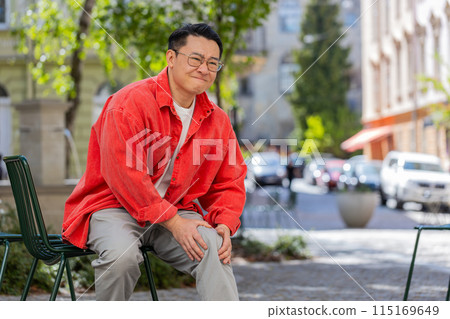 Asian mature man suffer from painful severe knee joint ache, leg muscles illness cramps rheumatism Asian mature man suffer from painful severe knee joint ache, leg muscles illness cramps rheumatism 115169649
