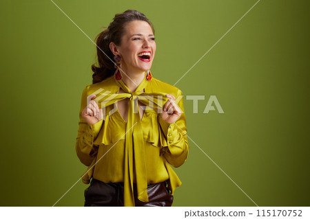 happy healthy woman isolated on green happy healthy woman isolated on green 115170752