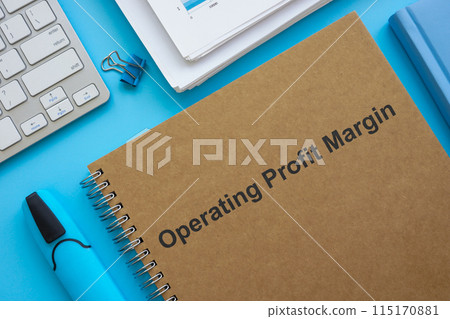 Operating profit margin documents, papers and marker. Operating profit margin documents, papers and marker. 115170881