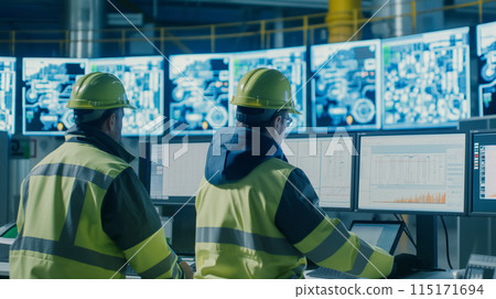 Engineers Monitor Manufacturing Processes Engineers Monitor Manufacturing Processes 115171694