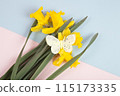 a bouquet of daffodils with a butterfly on it 115173335