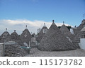 Alberobello roofs and blue sky 115173782