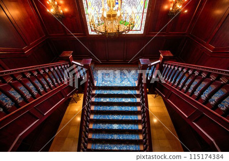 Gorgeous wooden staircase and stained glass 115174384