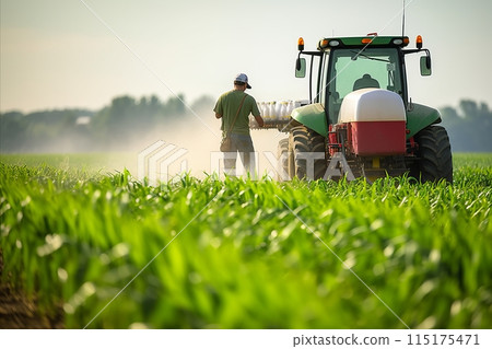 Farmer using precision equipment to apply insecticides in a cornfield, tractor-mounted precision sprayer 115175471