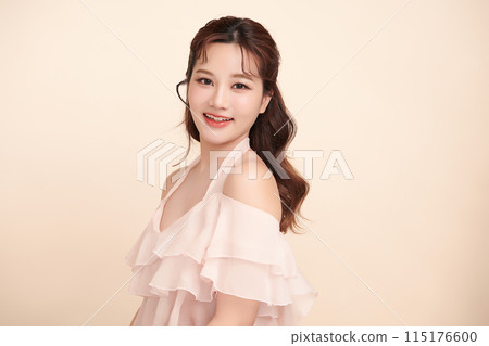 Beautiful young asian woman with clean fresh skin on beige background, Face care, Facial treatment, Cosmetology, beauty and spa, Asian women portrait. 115176600