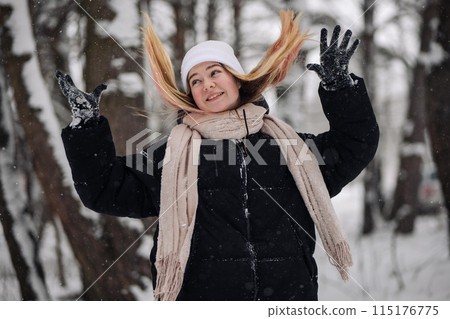 Funny teenage girl posing in the woods in winter. 115176775