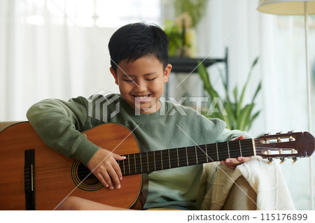 Boy Playing Guitar Boy Playing Guitar 115176899