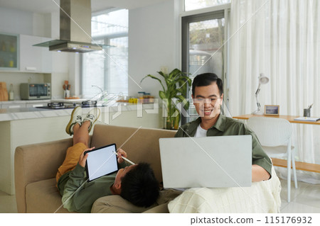 Father and Son Spending Time at Home Father and Son Spending Time at Home 115176932