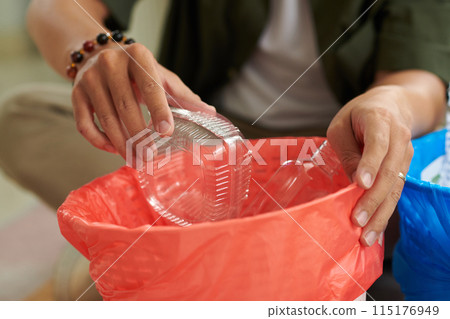 Man Sorting Garbage in Baskets 115176949