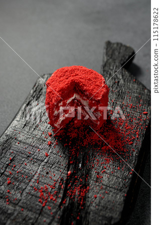 Red Velvet cake. Biscuit, cream. On a black background Red Velvet cake. Biscuit, cream. On a black background 115178622