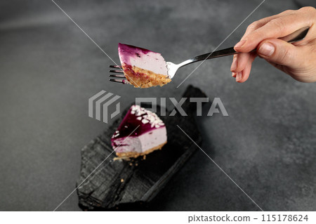 Blueberry cheesecake. On a black background 115178624