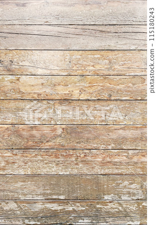 Vertical background image of an aged wooden wall surface with peeling varnish and light brown wood grain Vertical background image of an aged wooden wall surface with peeling varnish and light brown wood grain 115180243