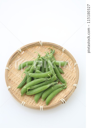 Snap peas in a basket top view 115180327