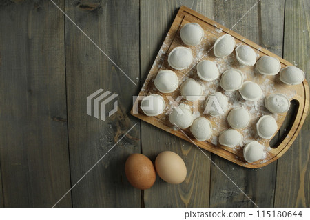 The process of making dumplings. Shaping. Top view The process of making dumplings. Shaping. Top view 115180644