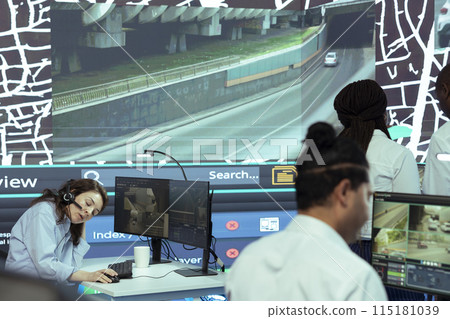 Frustrated employee working under pressure in agency control center, failing to properly monitor delivery trucks in traffic. Operator feels overworked, uses satellite map and gps tracking. Frustrated employee working under pressure in agency control center, failing to properly monitor delivery trucks in traffic. Operator feels overworked, uses satellite map and gps tracking. 115181039
