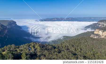 Low hanging clouds in Jamison Valley on a cold morning 115181428